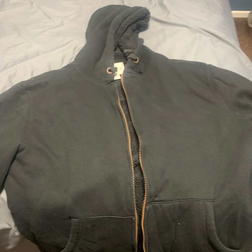 Black hooded Sherpa lined jacket.